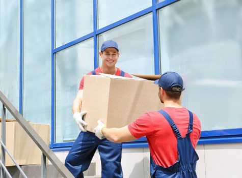 Removal van and movers ready for a local house move in Morden