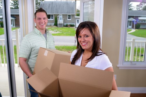 Van and mover assisting with transport across Morden