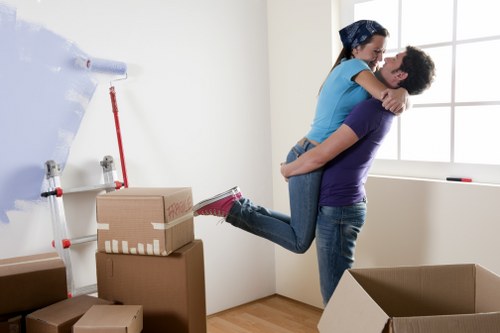 Loading household furniture into a removal van in Morden
