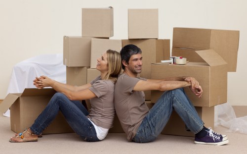 Team member loading items safely into a moving van