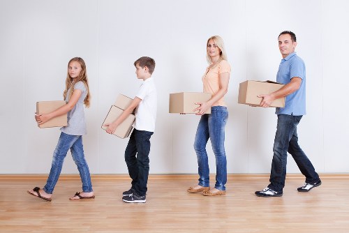 Office relocation team handling desks and office items near Morden