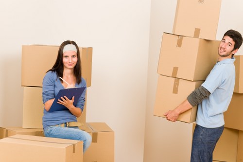 Household boxes and moving equipment prepared for removals in Morden
