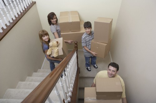 Commercial and office items being transported by a local removals team
